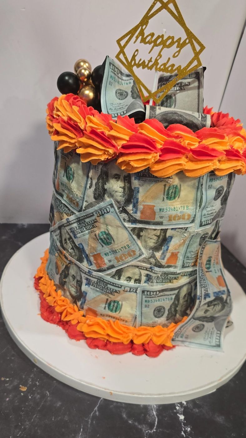 Birthday cake covered in edible hundred dollar bills with orange piping