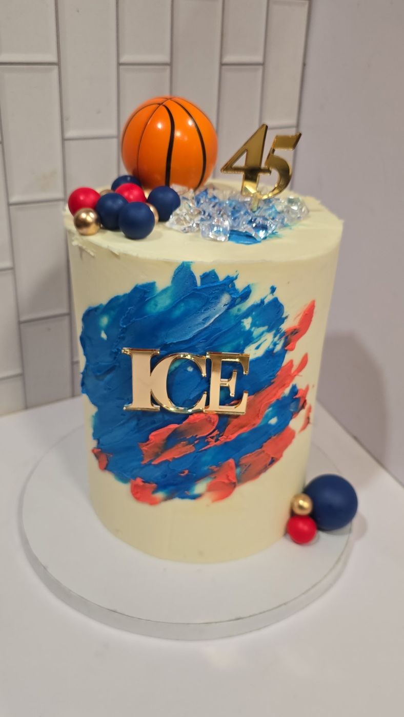 Basketball-themed birthday cake with a painted blue and red design